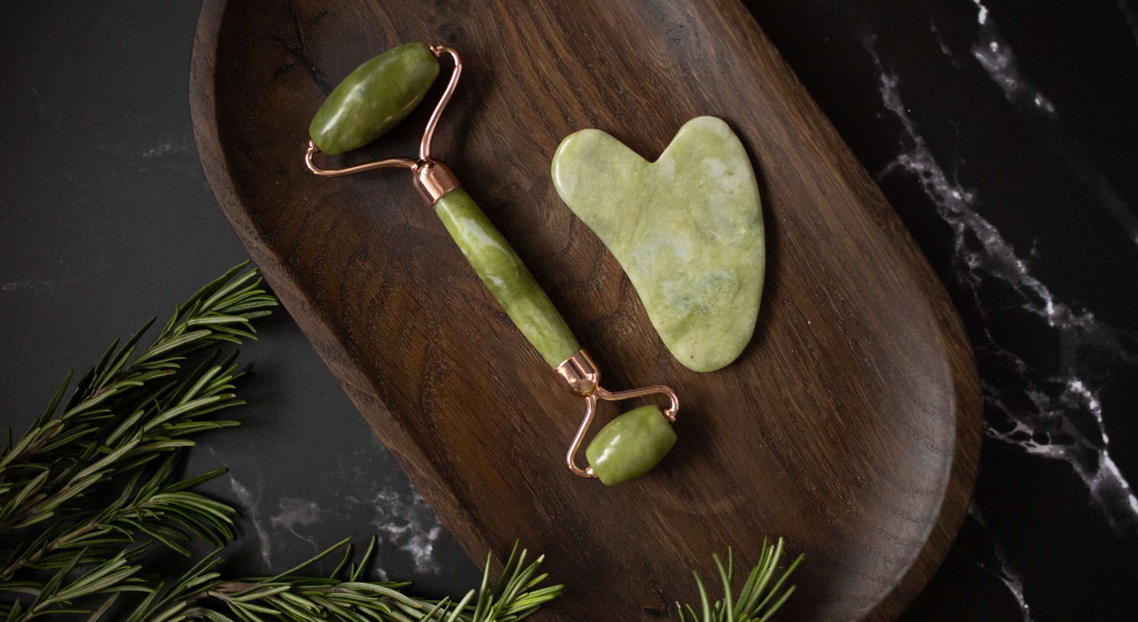 Image displaying a hand holding a gua sha stone, showcasing its use in skincare routines and wellness practices.
